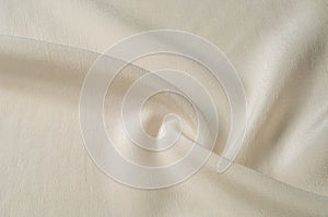 Texture background pattern. White silk fabric. Closeup of a rippled white silk fabric. Advertising space. Smooth elegant white si