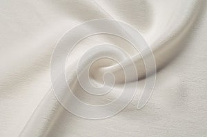 Texture background pattern. White silk fabric. Closeup of a rippled white silk fabric. Advertising space. Smooth elegant white si