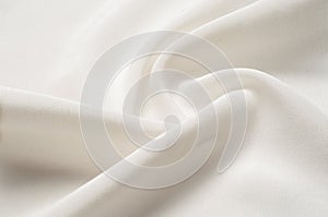 Texture background pattern. White silk fabric. Closeup of a rippled white silk fabric. Advertising space. Smooth elegant white si