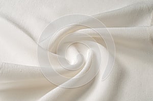 Texture background pattern. White silk fabric. Closeup of a rippled white silk fabric. Advertising space. Smooth elegant white si