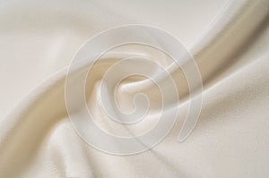 Texture background pattern. White silk fabric. Closeup of a rippled white silk fabric. Advertising space. Smooth elegant white si