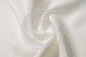 Texture background pattern. White silk fabric. Closeup of a rippled white silk fabric. Advertising space. Smooth elegant white si