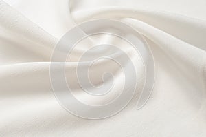 Texture background pattern. White silk fabric. Closeup of a rippled white silk fabric. Advertising space. Smooth elegant white si