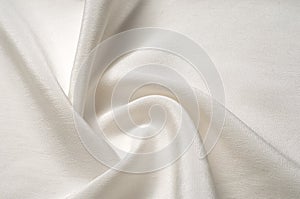 Texture background pattern. White silk fabric. Closeup of a rippled white silk fabric. Advertising space. Smooth elegant white si