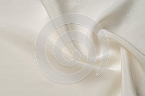 Texture background pattern. White silk fabric. Closeup of a rippled white silk fabric. Advertising space. Smooth elegant white si