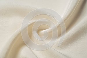 Texture background pattern. White silk fabric. Closeup of a rippled white silk fabric. Advertising space. Smooth elegant white si