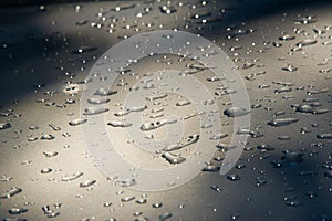 Texture background. raindrops on paintwork. Precipitation in the photo