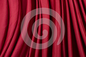 Texture, background, template. Silk fabric. Red silk drapery and upholstery fabric. Solid fabrics for backdrop, drapes, flags