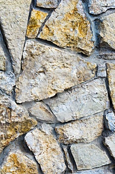 Texture, Background. Wild stone wall lined. sandston