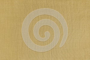 Texture background of yellow linen fabric, cloth surface, weaving of natural cotton fabric