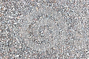 Texture of ballast of broken stone, chippings, macadam, scree. Background, top view.