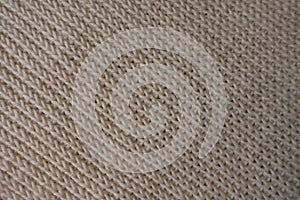 Texture of beige knitted fabric ribbing pattern photo