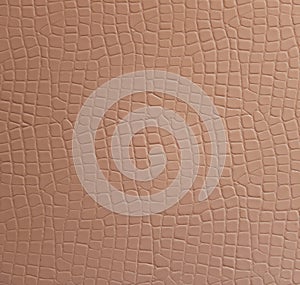 Texture of a beige leatherette