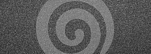 The texture of black fluted denim.Background of black jeans.