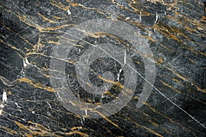 Texture of black marble rock for background.