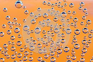 Texture of blue airbubbles on orange backroud