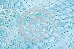 Texture with blue color fishnet on blue background