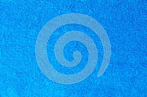 Texture of a blue cotton towel as a background