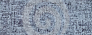 Texture of blue and gray color fluffy background of soft, fleecy cloth. Texture of textile closeup