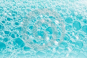 Texture of blue soap foam closeup