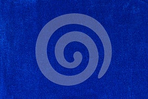 The texture of the blue velvet. The background of blue cloth. Background of blue velvet.