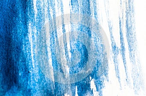 Texture of blue watercolor paint on white paper. Horizontal background with stains of watercolour brush strokes.