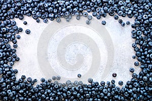 Texture of blueberry berries close up. Border design. Fresh blueberries background with copy space for your text. Vegan