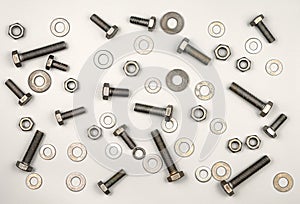 Texture of bolts, nuts, washers on a gray background