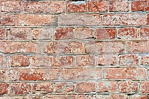 The texture is brick. Brick wall made of red bricks. Old masonry. Collapsed wall of a house