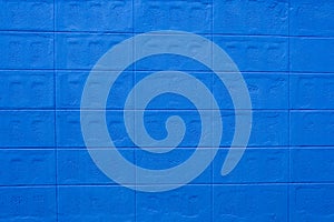 The texture of the brick wall of many rows of bricks painted in blue color  Background.