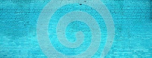 The texture of the brick wall of many rows of bricks painted in cyan colo