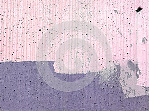 Texture of bright pastel pink painted on purple concrete wall