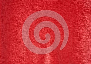 Texture of bright red cow leather, scarlet color