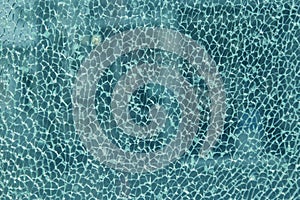 Texture of broken glass with beautiful mosaic seams, blue hue, b