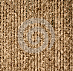 Texture of brown burlap, rough fabric with fibers for bags, macro