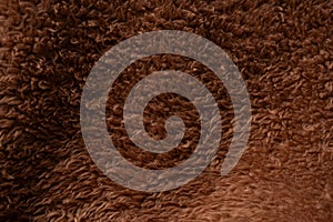 Texture of a brown faux fur as a background