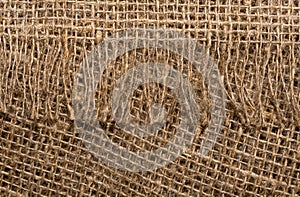 The texture of the burlap fabric is close-up. Packaging material. Background Of Burlap Hessian Sacking