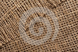 The texture of the burlap fabric is close-up. Packaging material. Background Of Burlap Hessian Sacking