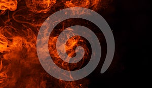 Texture of burn fire. Flames on isolated black background. Texture for banner,flyer,card