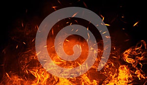 Texture of burn fire with particles embers. Flames on isolated black background. Texture for banner,flyer,card .