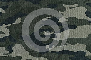 texture of camouflage fabric. textured background close-up photo