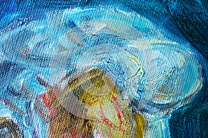 Texture of a canvas with large brushstokes of blue oil paint.