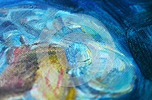 Texture of a canvas with large brushstokes of blue oil paint.