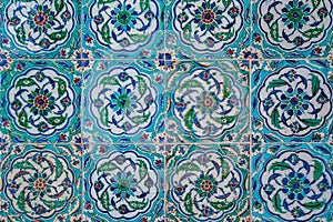 Texture of ceramic tiles in oriental East style. Turkish ceramic tiles lined on the wall. Old azulejo pattern floral