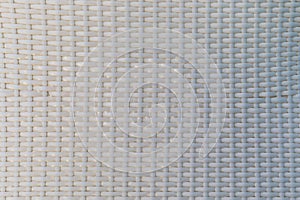 The texture of the chair made of plastic white wicker