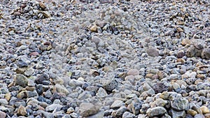 Texture of colored pebble stones at beach on Iceland