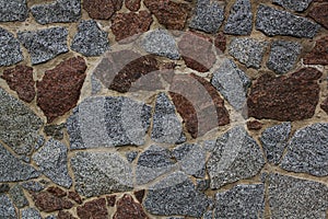 Texture of colored stone pebble wall for background