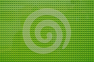 Texture of combined and multiplied green lego plates photo