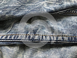 Texture composition of blue vintage retro jeans.