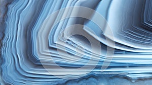 The texture of concentrically layered white-blue agate